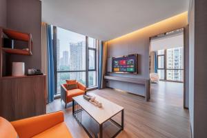 TV a/nebo společenská místnost v ubytování ChongQing Could Hotel 重庆云禧酒店