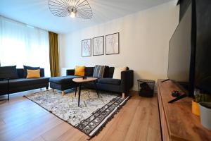 a living room with a couch and a table at FLH - Relax Home in Sibiu