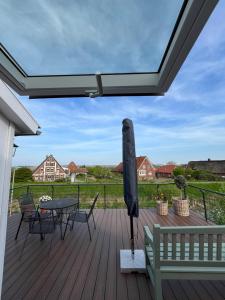Balkón nebo terasa v ubytování Ferienhaus "Deichperle" mit Flussblick