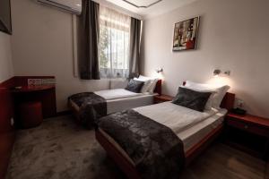 Postel nebo postele na pokoji v ubytování Hotel Bosna 1