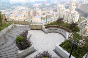 a set of stairs with a view of a city at Green Court Residence Jinqiao Diamond Shanghai in Shanghai