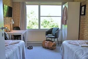 Postel nebo postele na pokoji v ubytování Flinten Horsens