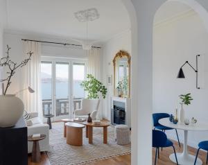 a living room with a view of the ocean at Camelia in Belgirate