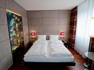 Postel nebo postele na pokoji v ubytování Hotel Sternen Oerlikon