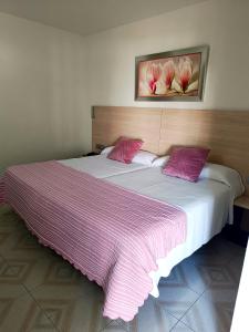 Postel nebo postele na pokoji v ubytování Hotel Oasis Familiar