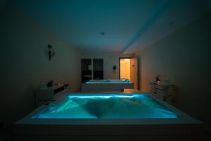 a bathroom with a blue tub in a room at Excelsior Palace Portofino Coast in Rapallo