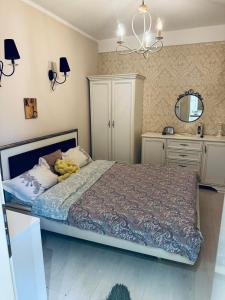 a bedroom with a bed and a mirror at Apartman Maja in Herceg-Novi +20 photos