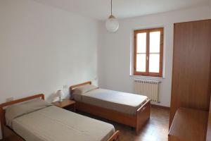 Postel nebo postele na pokoji v ubytování Elba Casale al Mare Cm2b