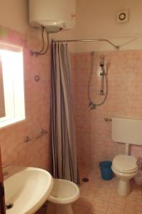 a bathroom with a shower and a toilet and a sink at Elba Casale al Mare Cm2a in Marina di Campo