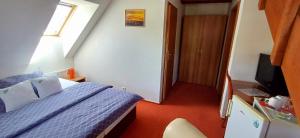 TV a/nebo společenská místnost v ubytování Wellness & Sport Hotel TTC