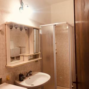 a bathroom with a sink and a shower at Casa vacanze vista mare a Budoni - sam01 in Tanaunella