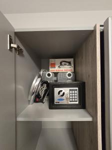 a shelf with a radio in a room at Apartment Benda in Pag