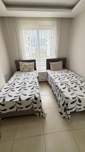 Postel nebo postele na pokoji v ubytování Konyaaltı tatil evleri & konaklama Türkiye - Antalya