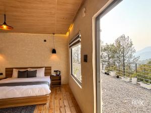 Postel nebo postele na pokoji v ubytování Anupraas Resort
