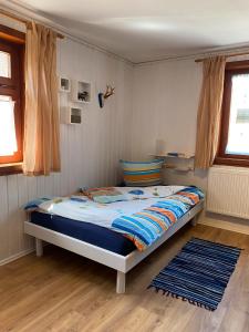 a bedroom with a bed in a room at Hofgut Homboll in Hilzingen