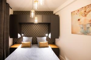Posteľ alebo postele v izbe v ubytovaní La Suite Sépia - Superbe appartement Vieux Lyon