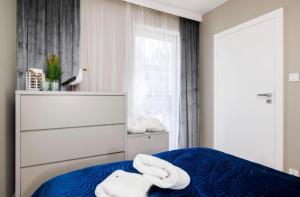 Giường trong phòng chung tại Apartament Baltic A11 +31 ảnh