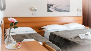 Postel nebo postele na pokoji v ubytování Hotel Fattori + 23 fotografií