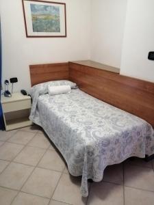 Postel nebo postele na pokoji v ubytování Hotel Trifoglio