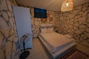 Postel nebo postele na pokoji v ubytování Mor Salkım Konağı