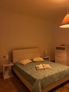 a bedroom with a bed with two towels on it at Monte do Carapetal in Amareleja +16 photos