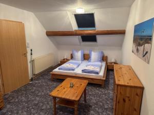 Ένα ή περισσότερα κρεβάτια σε δωμάτιο στο Ferienwohnungen Am Mühlenhügel