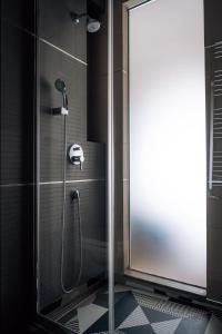 a shower with a glass door in a bathroom at Boutique Hotel Townhouse 27 in Belgrade +80 photos