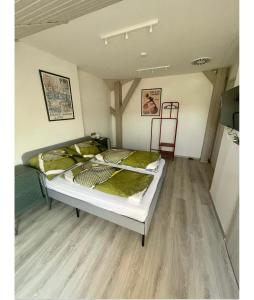 Postel nebo postele na pokoji v ubytování Tenisz Apartman