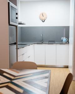 Cuisine ou kitchenette dans l'établissement Chez Abel