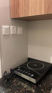a kitchen with a stove top oven in the corner at استديو الجاكرندا غرناطه in Riyadh