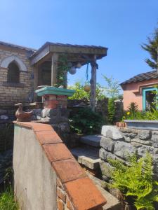 a stone wall in front of a house at Bohemian Bell Tent in Kinvara County Galway in Kinvara +22 photos