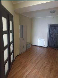 an empty room with a wooden floor and a door at Центр Кондиціонер Парковка in Luts'k +1 photo