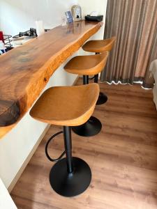 a bar with two stools at a counter at KAI Ichinomiya in Ichinomiya +26 photos