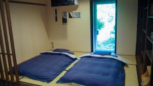 Ein Bett oder Betten in einem Zimmer der Unterkunft YuYu Hakone - Private Open Air Onsen Usage Guaranteed