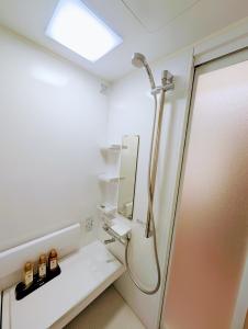 a bathroom with a shower and a mirror at 縁 yukari in Takamatsu +39 photos
