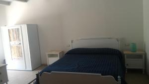 Postel nebo postele na pokoji v ubytování Agriturismo Cordiglianello + 4 fotografie