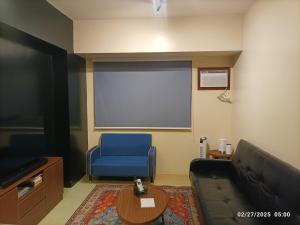 Un lugar para sentarse en New corner unit 1BR at Avida with Espresso machine