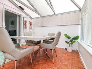 a dining room with a table and chairs at 46 Dalby Road in Leicester