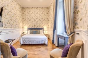 Postel nebo postele na pokoji v ubytování Mangili Garden Hotel