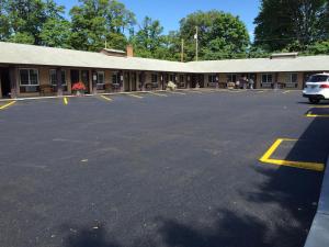 an empty parking lot in front of a building at Downtown Inn in Eugene