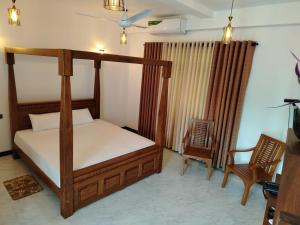 Postel nebo postele na pokoji v ubytování Diora Hotel