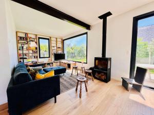 a living room with a couch and a fireplace at Villa 7 pièces à Quiberon - Proche plage, jardin, parking, WiFi - FR-1-478-307 in Quiberon