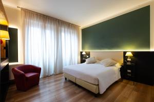 Postel nebo postele na pokoji v ubytování Hotel Italia