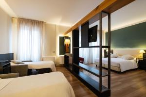 Postel nebo postele na pokoji v ubytování Hotel Italia
