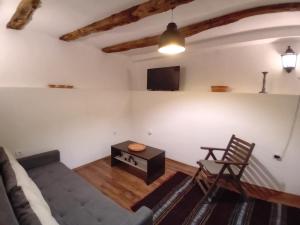 a living room with a couch and a table at Arbinovo Lodge in Ohrid