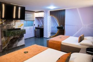 Postel nebo postele na pokoji v ubytování Hotel Bacatá Isla
