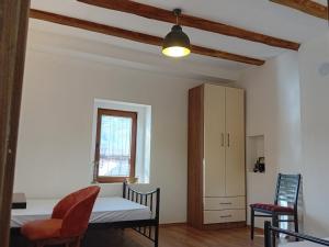 a room with a table and chairs and a cabinet at Arbinovo Lodge in Ohrid