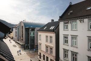 a group of buildings next to each other at Bergen City Living in Bergen