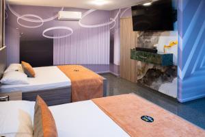 Postel nebo postele na pokoji v ubytování Hotel Bacatá Isla