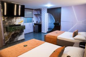 Postel nebo postele na pokoji v ubytování Hotel Bacatá Isla